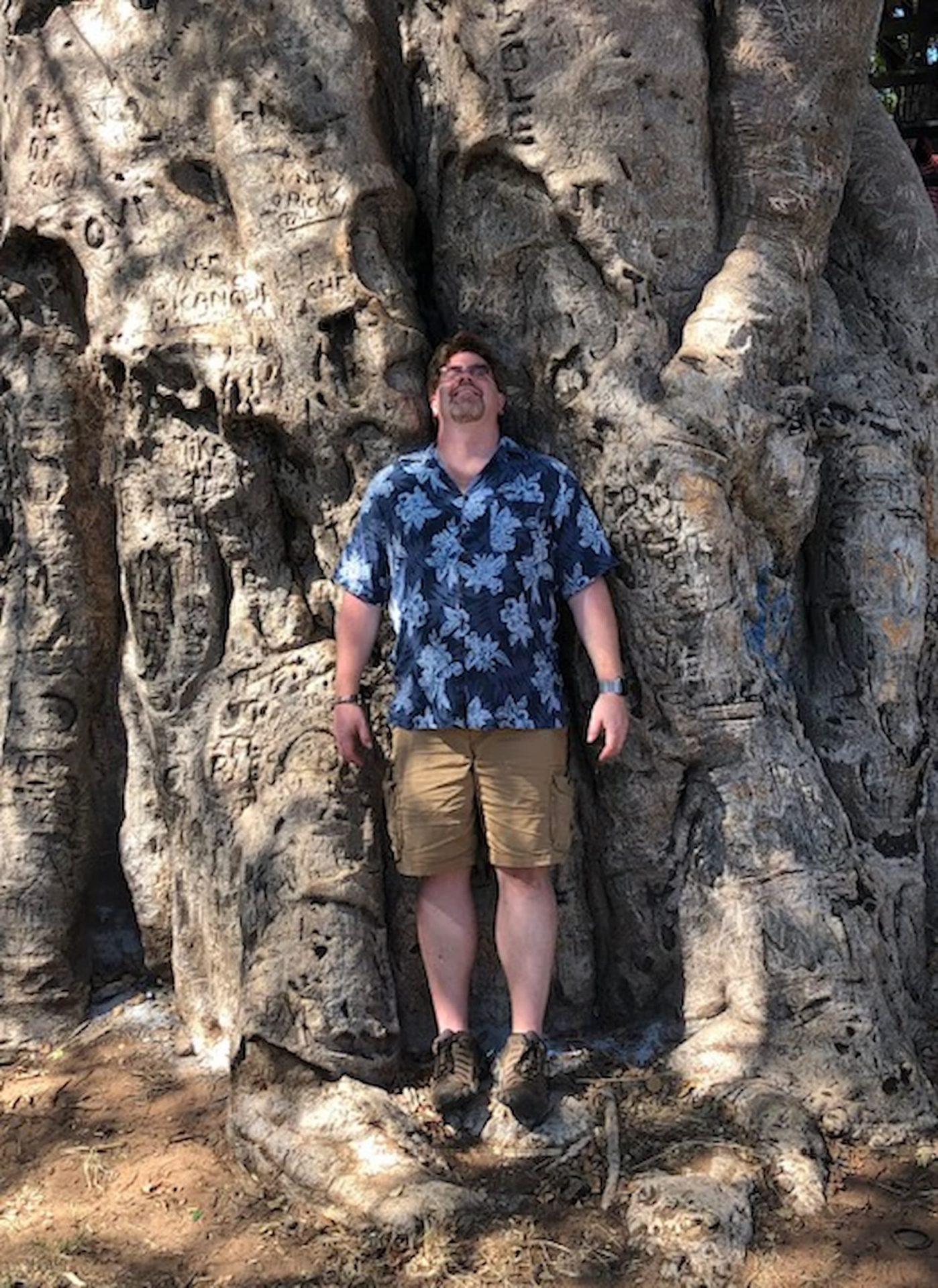 Scott standing under a large tree.